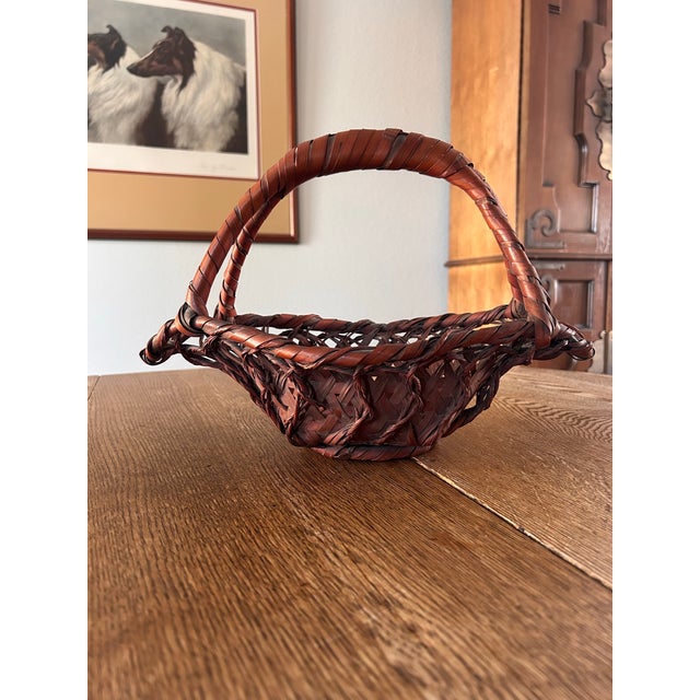 Antique Japanese Ikebana basket. Woven, split bamboo. Rich color and sturdy construction. Whimsical shape makes it a great...