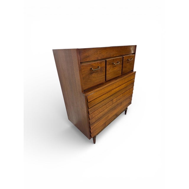 This exceptional Mid-Century Modern High Chest by American of Martinsville exemplifies timeless craftsmanship and refined...