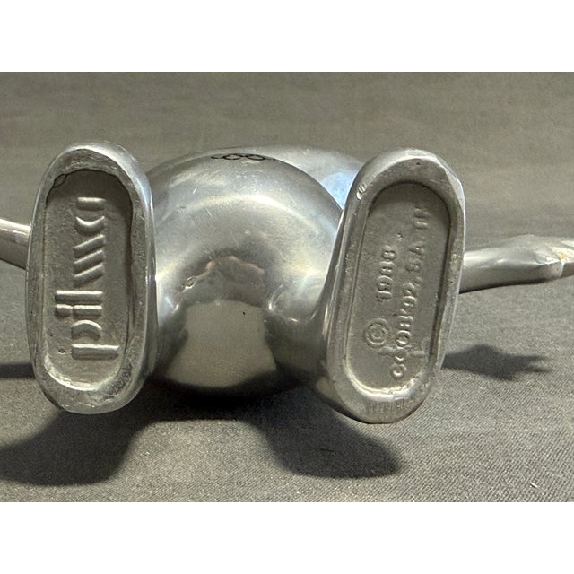 Cobi by Pilma in aluminum. Size: 14 cm. Designer: Javier Mariscal. Year of creation: 1988 Cobi was the mascot of the 1992...