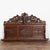 19th century carved wall shelf from Portugal, crafted in dark oak. Extensive hand carved decoration includes a central...