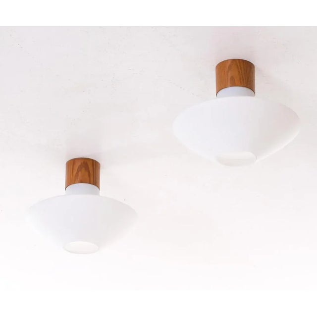 Opaline glass and oak. Produced by Luxus, Sweden, 1960s. This piece is attributed to the mentioned designer/maker. It has...