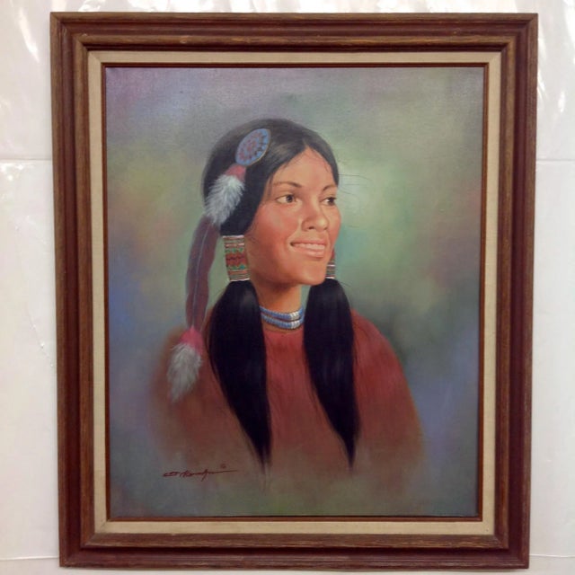 This is an oil painting depicting a Native American girl. She's wearing a beaded feather decoration in her hair,...