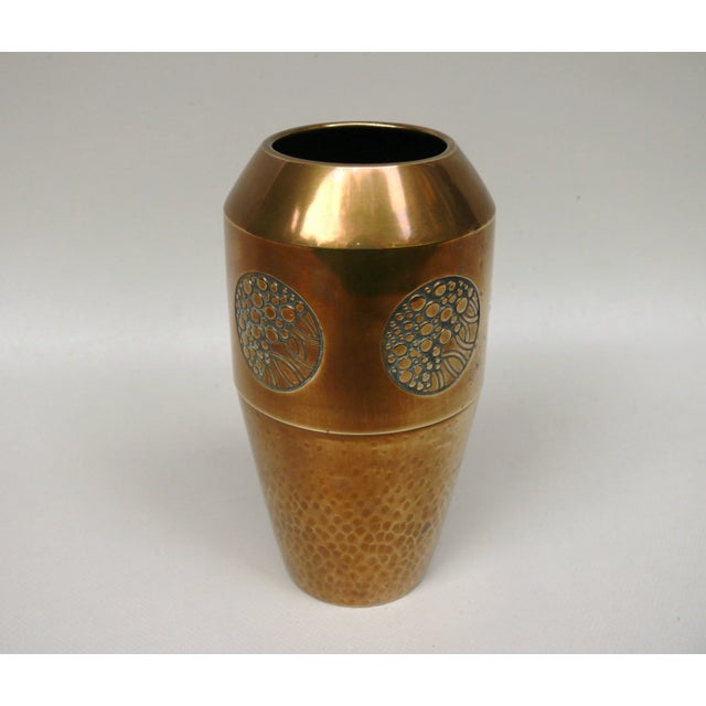 An elegant, delicate vase from the Art Nouveau period, made by WMF. The decoration in the form of a relief medallion is...