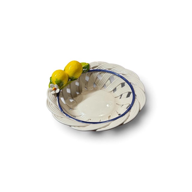 Charming brand-new Italian ceramic basket featuring an intricate open-weave design accented with sculptural yellow lemons,...