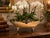 This elegant vintage silver-plated jardiniere combines sculptural detailing with timeless decorative appeal. Raised on...