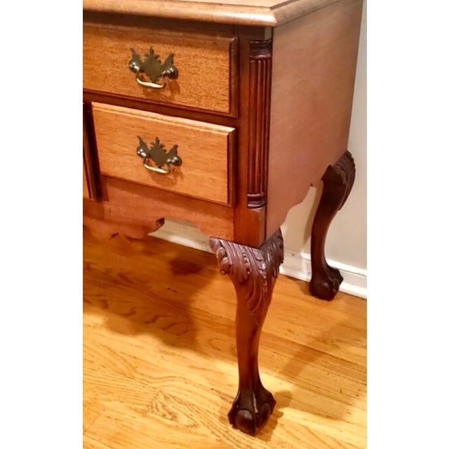 Fantastic vintage Chippendale lowboy. Beautiful hand carved sunrise design. Long and slender cabriolet legs. Acquired from...