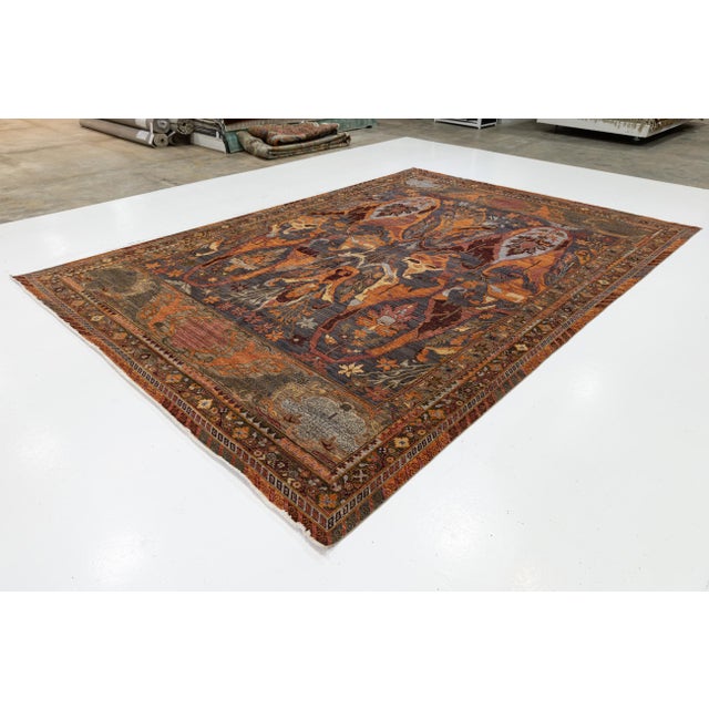 This stunning wool area rug reimagines traditional Persian craftsmanship through a contemporary lens. Inspired by the...