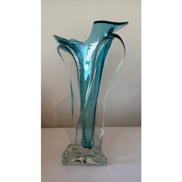 Ed Branson's internationally renowned handblown glass are distinguished by elegant, fluid shapes and jewel-like colors. Ed...