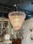 Gorgeous modern pink Murano glass waterfall chandelier. Beautiful shimmering glass in such a pretty shade of pale pink....