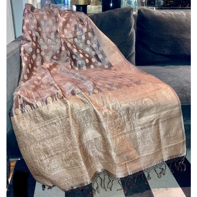 This Gold Paisley Silk Jacquard Decorative Organza Throw Shawl is a luxurious and versatile accessory for your decor or to...