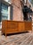 Large and lavish Mid Century Modern walnut dresser / credenza by Bassett for their “Outlook” collection. In fantastic...