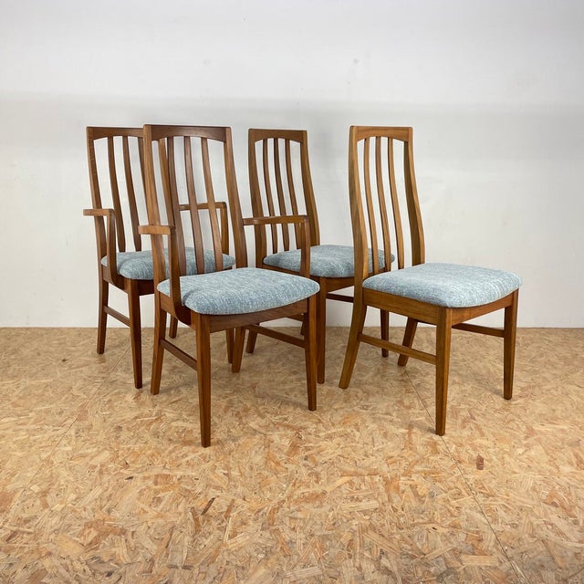 A set of four mid century teak dining chairs manufactured by William Lawrence of Nottingham. In excellent original...