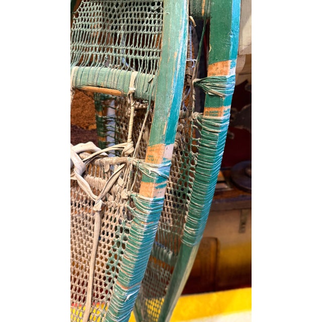 Green Antique Early 20th Century Cree Snowshoes With Babiche Lacing Green Paint For Sale - Image 8 of 11