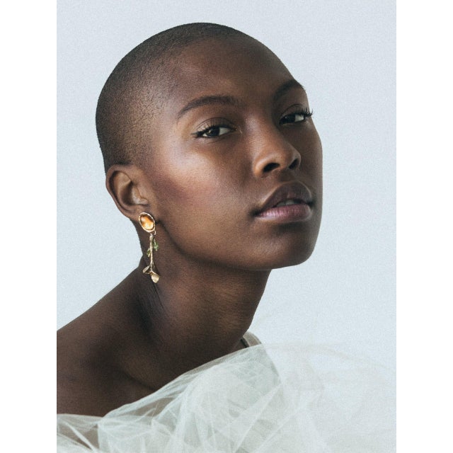 The Tulip flowers are hand-carved from wax and hang easily on ears with almost no weight. A pop of topaz color gives them...