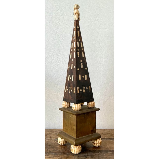 This extraordinary vintage obelisk is a masterclass in eclectic design, combining formal architectural proportions with...