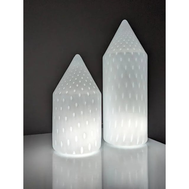 Beautiful pair of table lamps from the 80s created by Vetri Murano made of blown Murano glass with a beautiful pattern of...