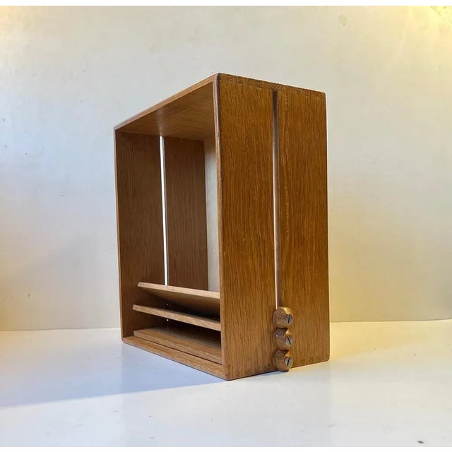 A fine oak organizer for documents. Beautiful handmade details to the edges and the three leave that adjust via a simple...