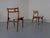 These Model 138 teak dining chairs were designed by Johannes Andersen and produced in Denmark by Uldum Møbelfabrik in the...