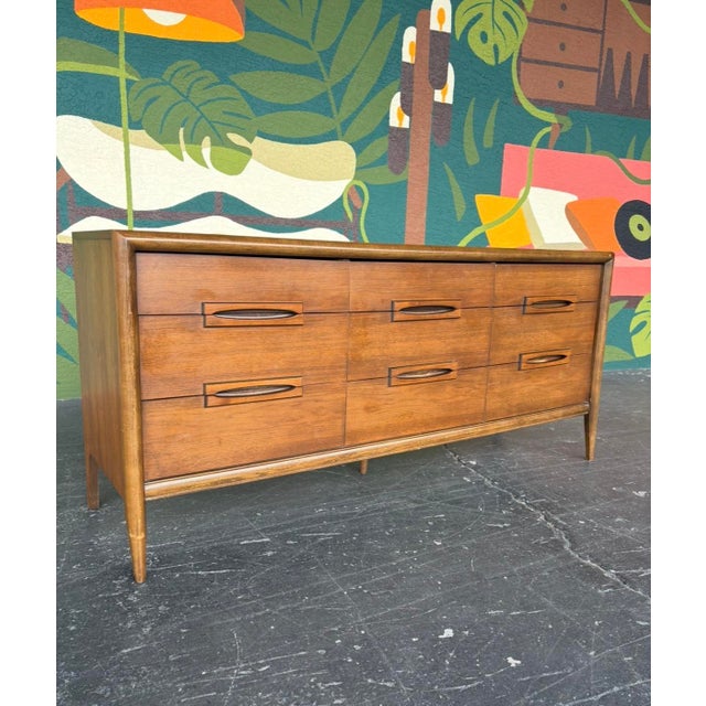 Designed by Leo Jiranek, this Bassett Outlook niner is a perfect mid century piece to use as a standard dresser, tv...