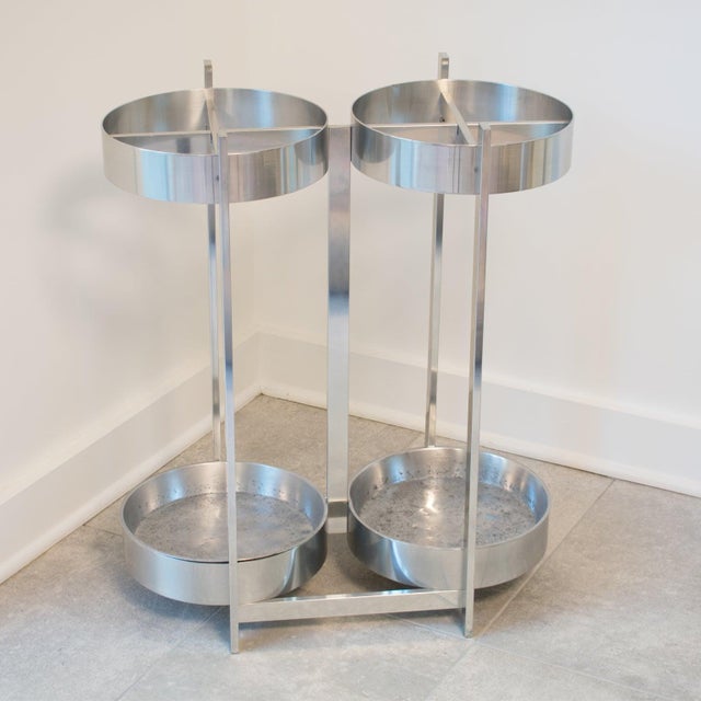 This elegant Mid-Century modernist aluminum umbrella stand or holder features an industrial Machine Age design with a...