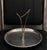 Evoking the futuristic spirit of the Jetsons and the Atomic Age, this sculptural stainless steel tray makes a bold...