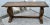 Vintage (1990's) Console Table has an Empire Style. Made by Ethan Allen. The Wood is Teak. Carved Wood with a Stretcher...
