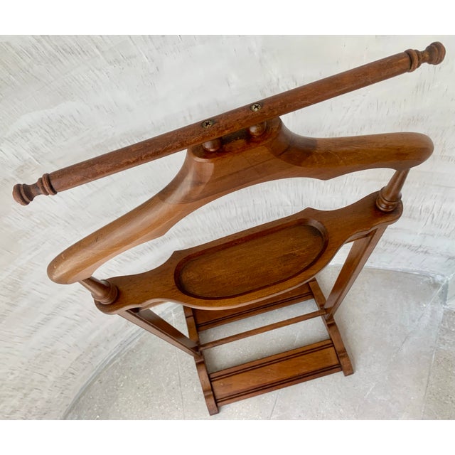 1960’s Vintage Mid-Century Modern Men’s Bedroom Wood Suit Valet. In solid wood with a beautifully aged patina, this...