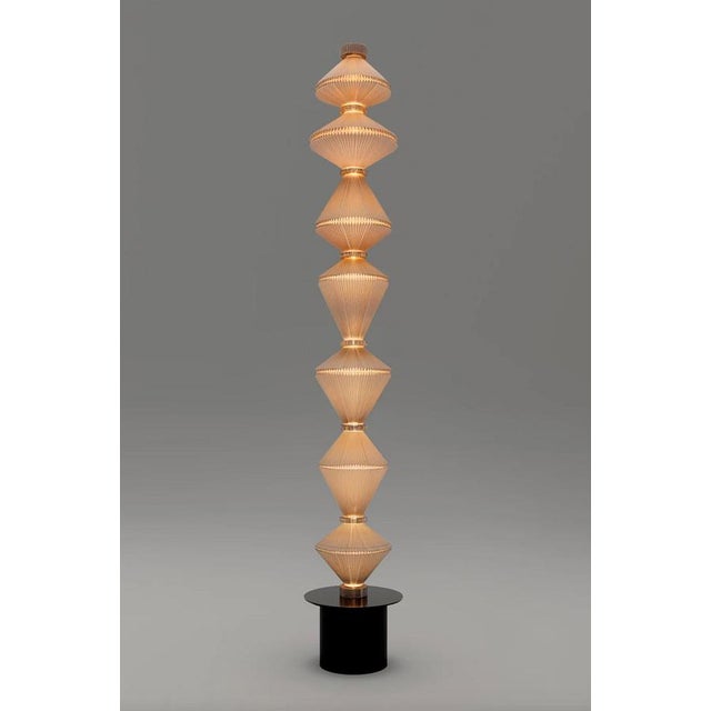 Atelier oï oïphorique p gr floor lamp for parachilna oïphorique displays an elegant textile diffuser. After turning on the...