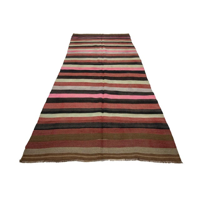 Colorful striped vintage handwoven kilim rug from Kars region of Turkey. Approximately 45-55 years old. In very good...