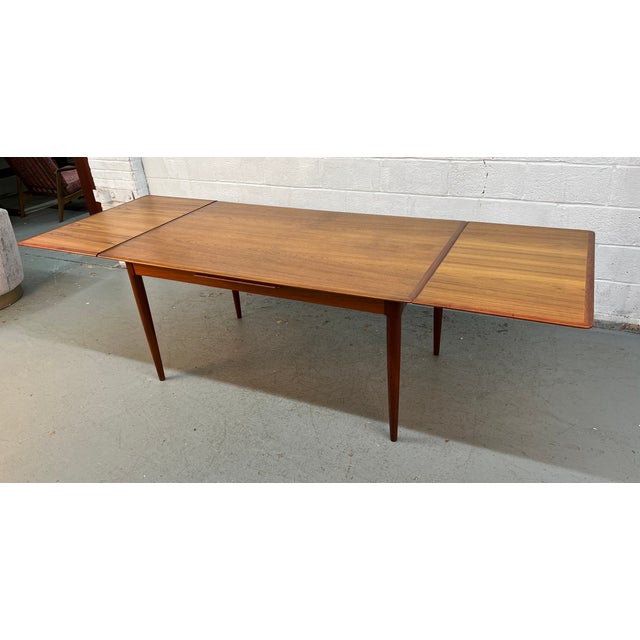 Timeless Danish Mid-Century Modern draw-leaf dining table designed by Skovmand & Andersen for Moreddi, showcasing the...