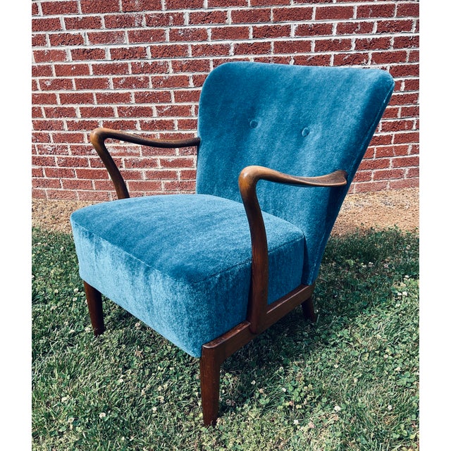 Exude classic mid-century sophistication with this striking Alfred Christensen Lounge Chair, crafted for the esteemed...