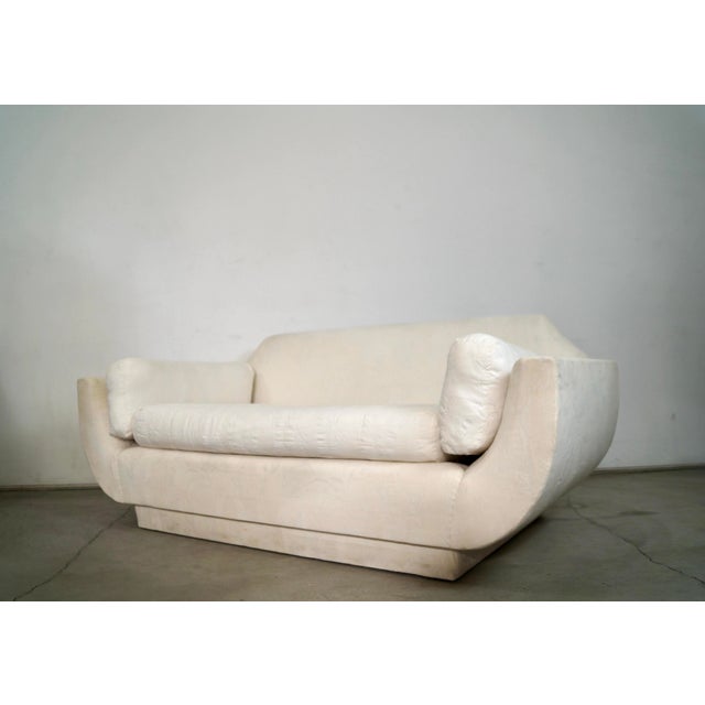 1960's Mid century Modern Hollywood Regency couch for sale. It has a unique gondola design with a plinth base, and gondola...