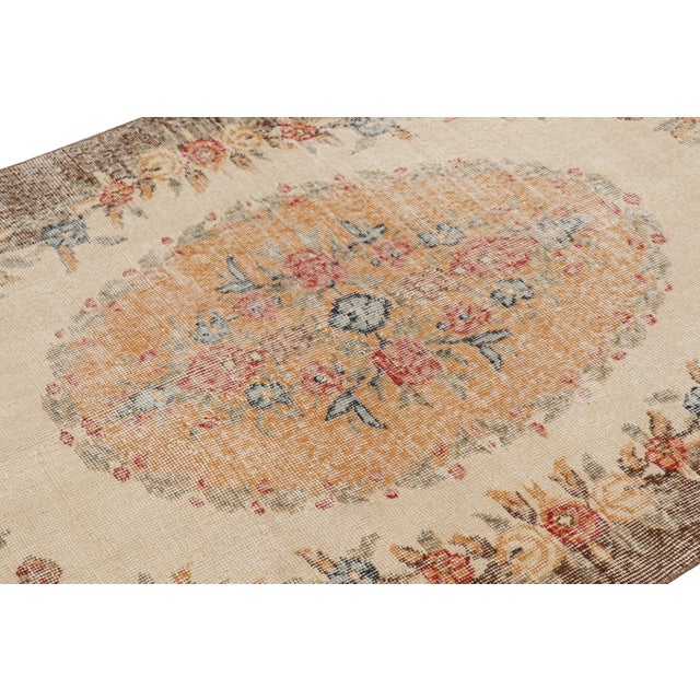Hand-knotted in wool and originating from Turkey circa 1960 – 1970, this 4x7 vintage Zeki Müren rug is a unique addition...
