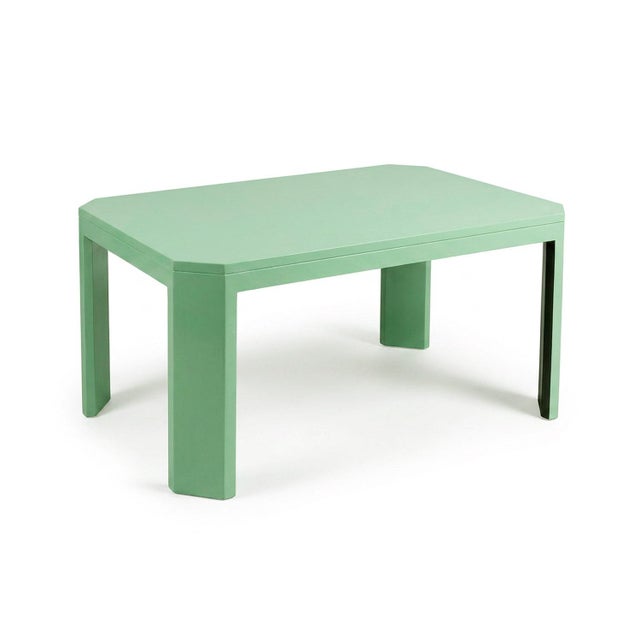 Dining Table in Aquamarine Lacquered Wood. At first glance, it’s simple. But stay with it, and something shifts. The edges...