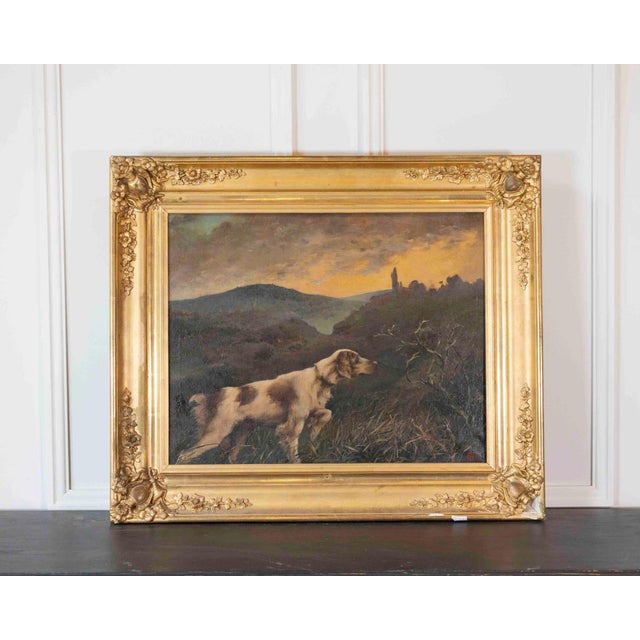 With a richly carved antique frame. Superb oil on canvas depicting a pointing dog (English Setter type) in a hunting...