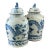 This large, elegant pair of Chinoiserie blue and white porcelain ginger jars features hand-painted dancing dragons and a...