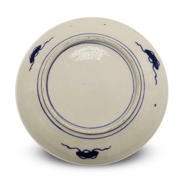 This porcelain wall plate is a decorative object manufactured in Japan at the end of the 19th century. This refined wall...