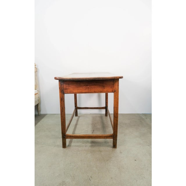 A rustic English tavern table with warm and inviting character, dating to the 19th century. Once a spot for convivial...