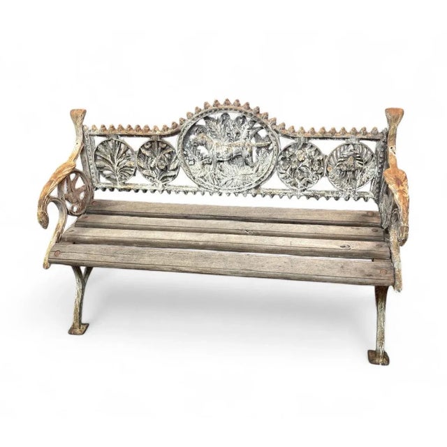 This charming vintage garden bench combines the durability of cast iron with the warmth of a wooden slat seat, making it a...