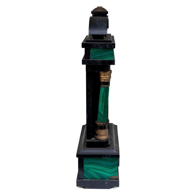 Russian Black Marble and Malachite Clock Stand, 19th century, gilt metal mounted. 14.5" H x 8.25" W x 3.5" D.