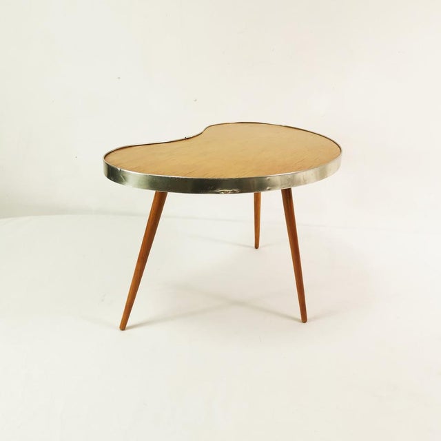 A table/flower stand, manufactured by Akti in Germany, 1960s. It features an irregular kidney shape. Constructed solidly...