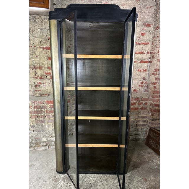 Bookcase or storage unit in patinated raw steel with matt black painted trim. Beautiful craftsmanship in wrought iron from...