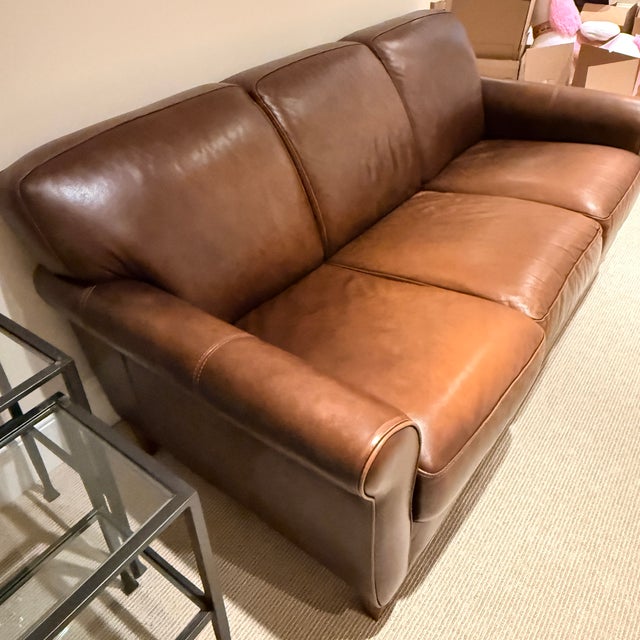 Chateau d’Ax Leather Sofa A classic leather three seat sofa with curved arms in a warm tobacco brown leather. The perfect...