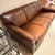 Chateau d’Ax Leather Sofa A classic leather three seat sofa with curved arms in a warm tobacco brown leather. The perfect...