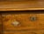 An English Georgian period pine dresser from the early 19th century, with open shelves, Doric style pilasters, petite door...