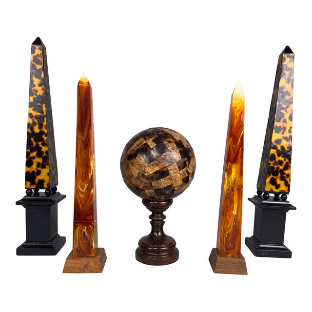 Collection of Decorative Obelisks and Sphere - Five Pieces This striking grouping features five distinctive decorative...