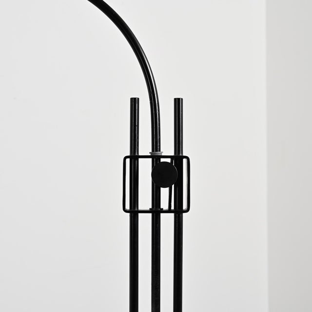 Vintage floor lamp produced by Holmegaard in Denmark around 1970. The black lacquered metal frame rests on a weighted...