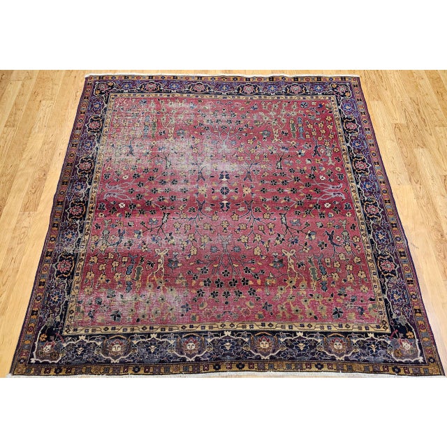 Exceptional Early 19th Century Agra Area Rug in an all over floral pattern in magenta-red field with an eggplant color bor...
