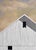 Summer Sunrise by Justin Wheatley is an acrylic painting on canvas of a tall white barn under an early peach sky. The...