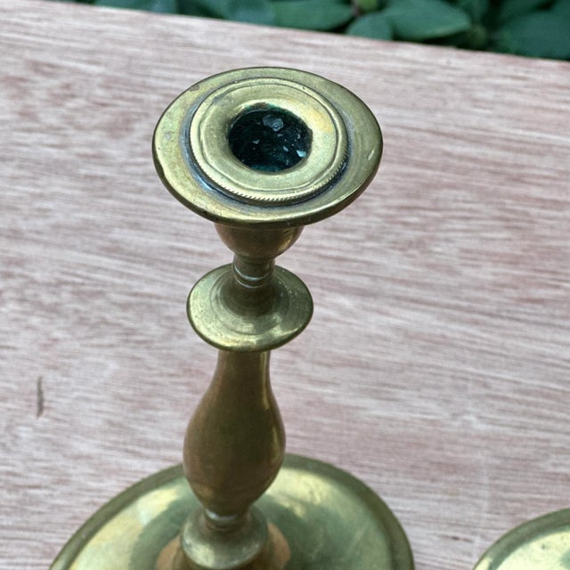 Pair of antique heavy solid brass candle holders. Do not appear to be signed. These are much heavier than similar items...